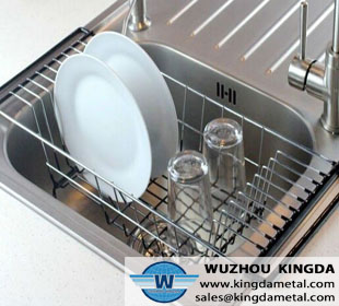 Metal dish drainer in sink